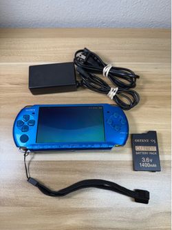 Blue PSP 3000 with 100 games installed.               A52