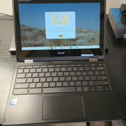 Chromebook Spin 511 + Belkin 2-in-1 magnetic wireless charging pad.