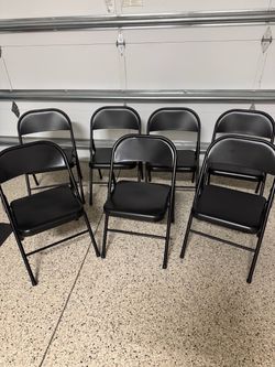 Black folding chairs (set of 7)