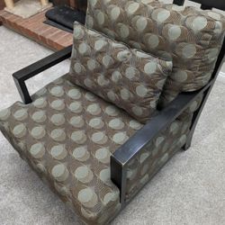 Wooden Chair With Brown And Green Patterned Cushions