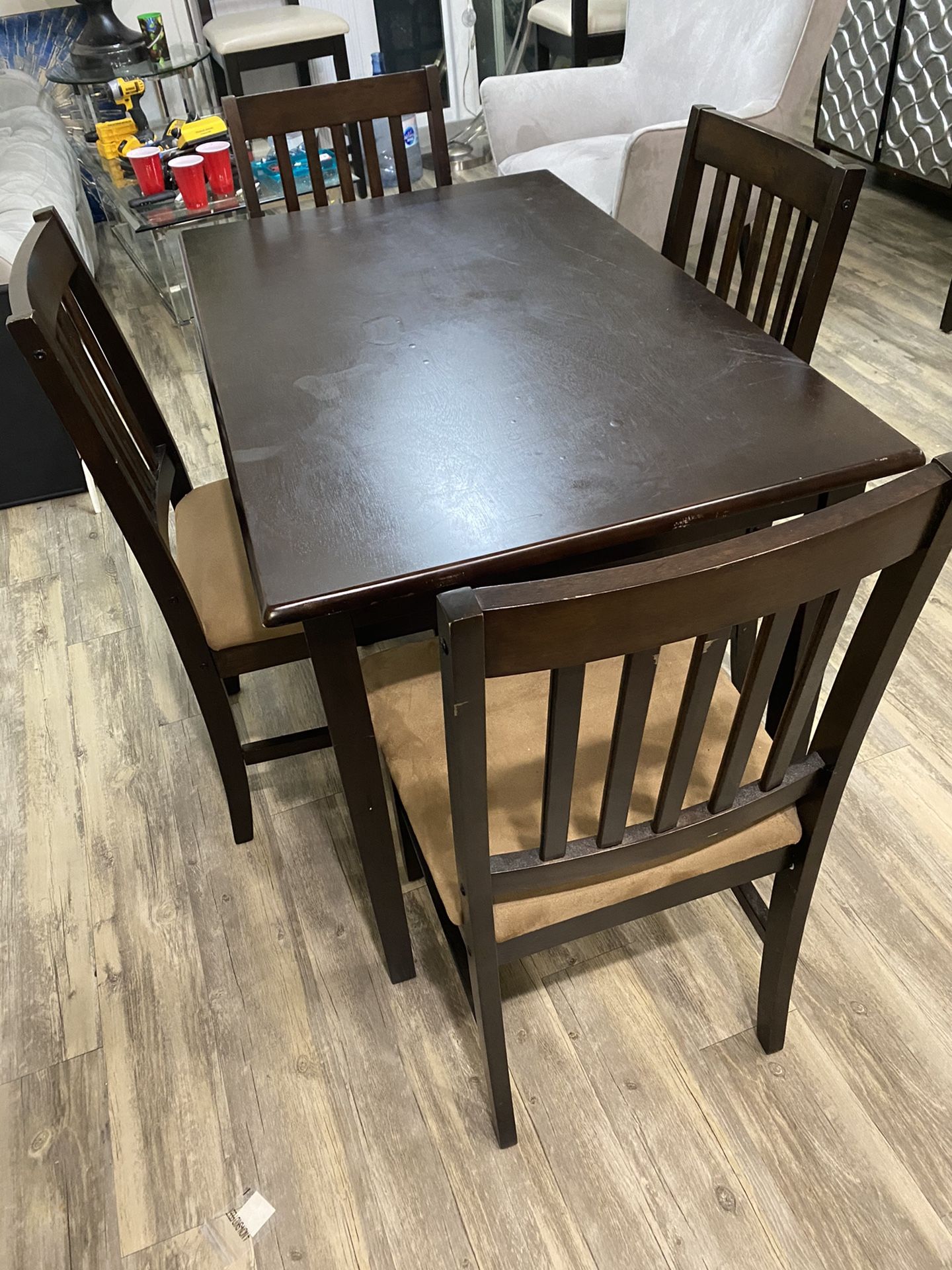 Dining table with four chairs. All chairs and table in good condition.