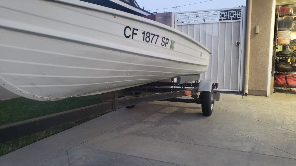 12 foot vintage Starceaft aluminum boat and trailer