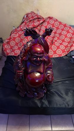 Large laughing Buhhda statue with a buhhda  wall piece