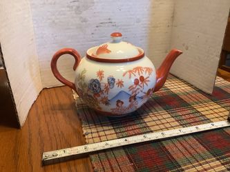 Japanese tea pot late 50s, excellent condition  • Glazed white porcelain with hand-painted enamel details. • Design: Features vibrant orange-red accen