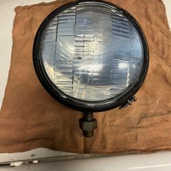 Headlight, fender or bumper mounted, external wiring terminals a , 6” diameter, mounting bolt looks like 9/16” 