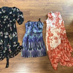 Includes floral, patterned, and red floral designs. Set of 3 Women's Dresses. Please read the prices. $18, $15 and $5. Look brand new ( still have a t