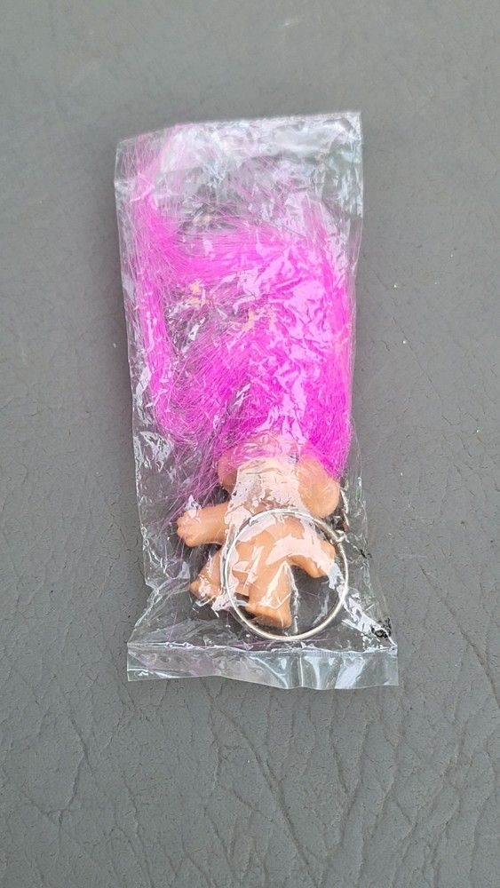 vintage Troll Doll keychain with pink hair, still in its original packaging.