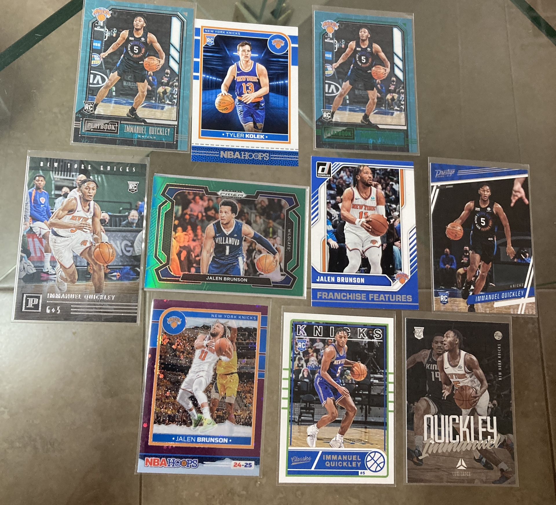 10 card NBA basketball New York Knicks lot including Jalen Brunson green Prizm, winter silver holo & Franchise Features sp etc .All cards are In good