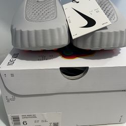 New Smoke Grey/Chrome Nike Mind 001  Size : 6M - 8W