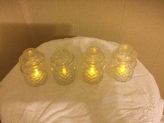 Set of four small glass jars