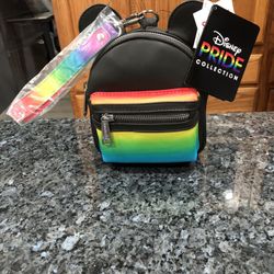 Disney Parks Pride Collection Mickey Mouse Loungefly Wristlet Brand New With Tags .  Size 6 inches tall with ears 7 1/2 inches tall and 5 1/2 inches w