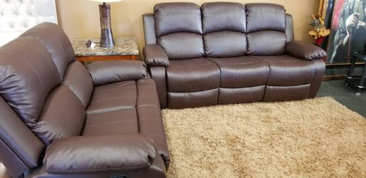 Brown bonded leather dual reclining sofa and love