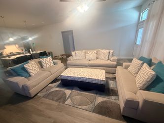 three piece living room set with ottoman and dining room set.￼