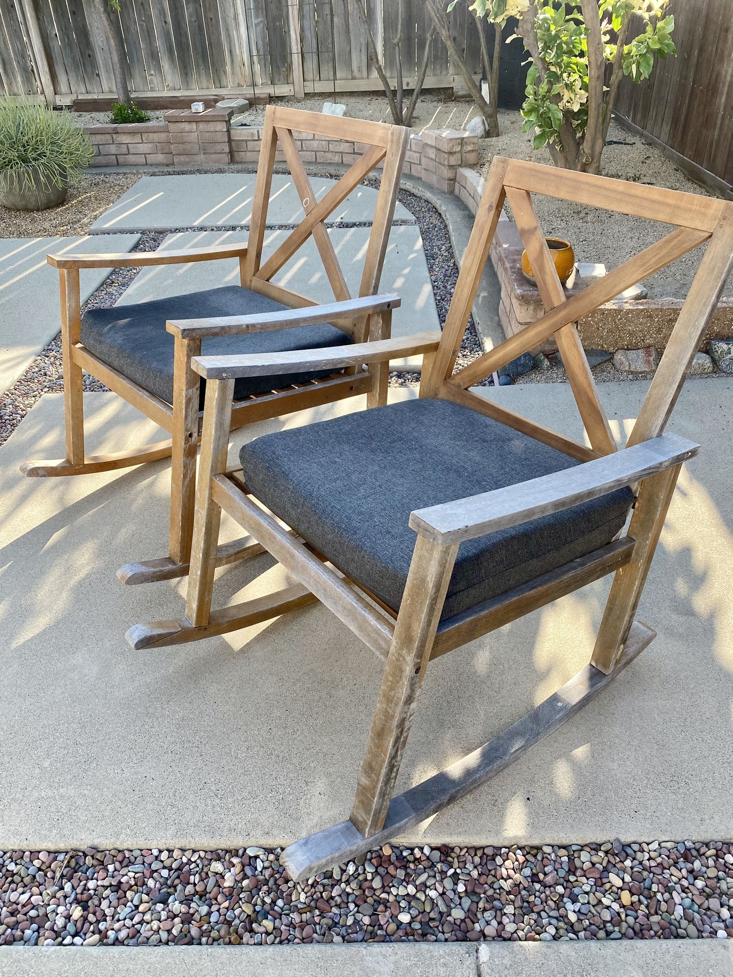 Two wooden Rocking Chairs w/ pads