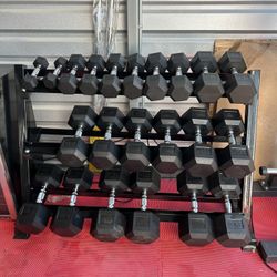New pair of 5,10,15,20,25,35,40,45,50, 55,60lb rubber dumbbells + rack. All new in box $820