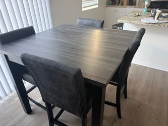 Dinner table with 4 chairs Ashley furniture dark gray