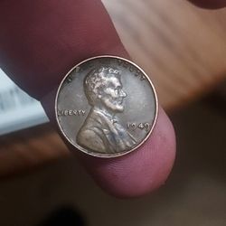 1949 wheat penny no mint mark slightly off struck