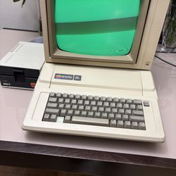 Vintage Apple IIe Computer With Monitor And Floppy Drive