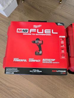 Milwaukee hammer drill with 2 batteries and charger