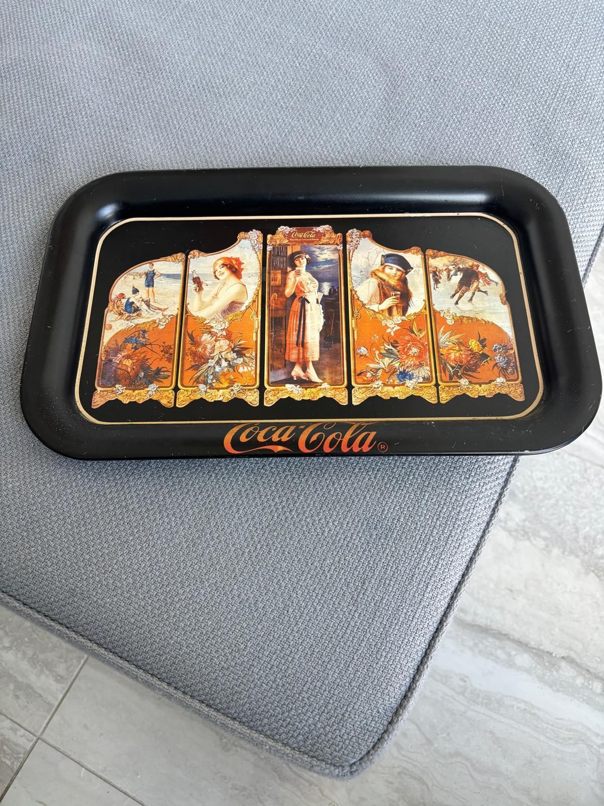 The item is a vintage Coca-Cola serving tray, a reproduction of a 1923 design …copyrighted in 1990… 14 “ x 9”. $20