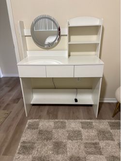White makeup vanity with chair