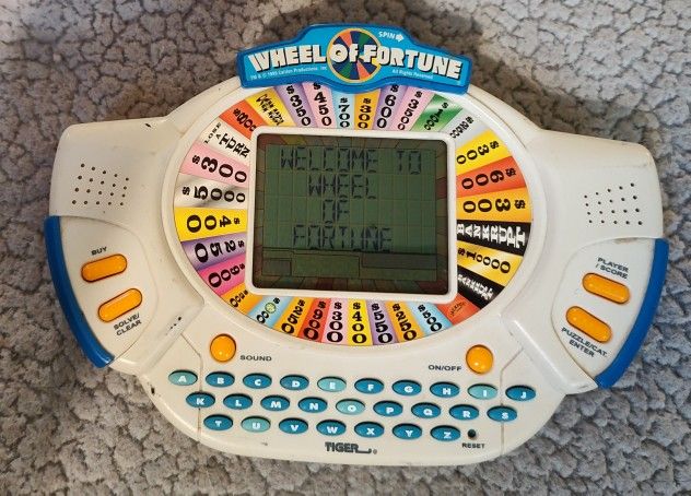 Vintage Wheel of Fortune Handheld Game with Expansion Cartridge Tiger 1999