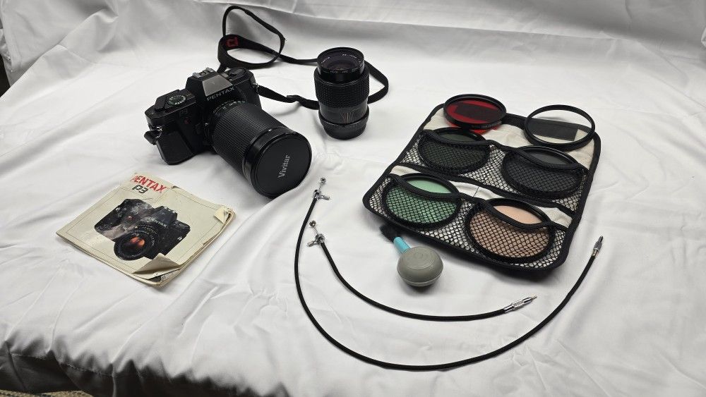 Pentax P3 35mm SLR Film Camera with two lenses and case.