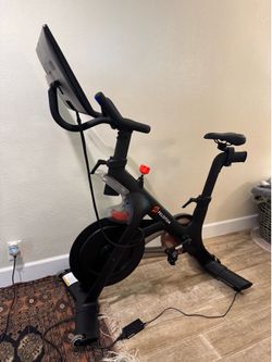 Peloton Bike with mat and shoes
