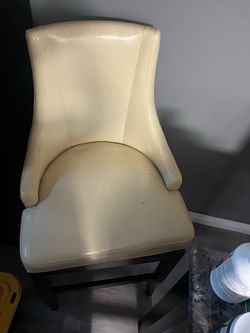 Two swivel bar chairs