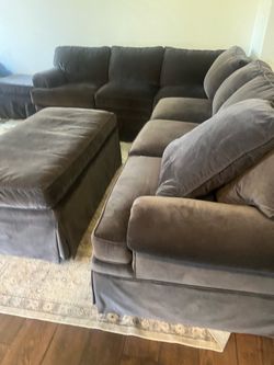 Gray couches with 2 ottomans