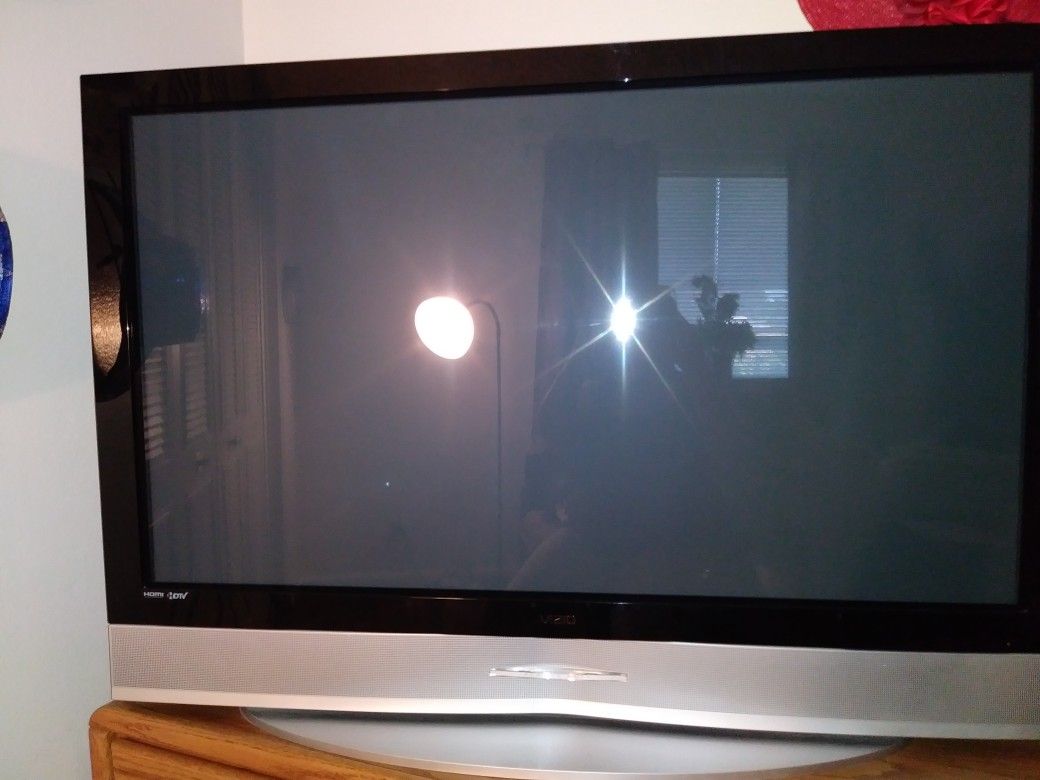 Older Vizio flat screen TV with remote. Great condition and works great. 48 1/2 " wide and 34 " tall