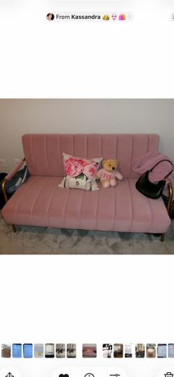 Pink couch with gold arm rests