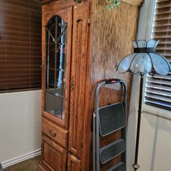 Oak  Curior cabinet Comes into pieces can be put together or can be separated as I have them , they're very large , oh heavy , they light up , they ha