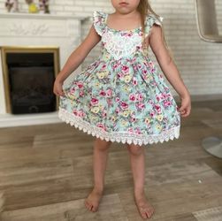 Beautiful backless floral girl's dress. Good for summer time.