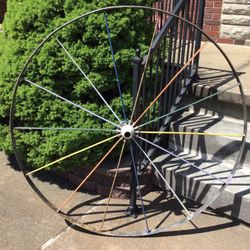 Antique metal wheel, 55 inches round