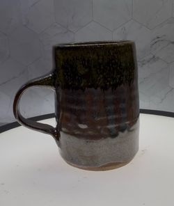 (1) Beautiful handmade stoneware mug features a double-glazed brown finish and a crystalized Tenmoku glaze.Handcrafted with a Tenmoku process that res