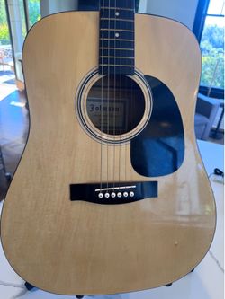 Beautiful Dreadnaught acoustic guitar from Johnson Music Company