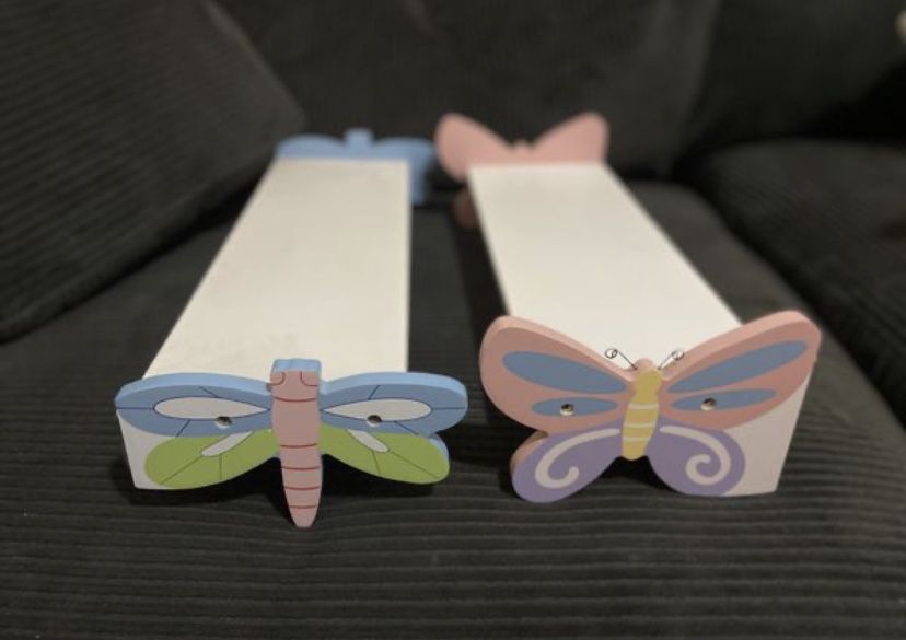 White shelves with butterfly and firefly