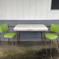 vintage formica table and two green chairs