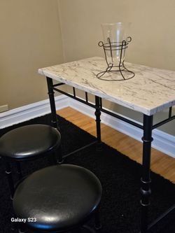 3 pc high table w with 2 bar stools
