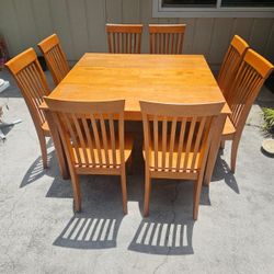  Wooden table and 8 chairs 