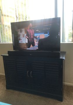 Roku tv, sound bar, tv stand