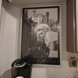 framed black and white poster featuring Marilyn Monroe. 