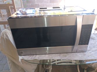 Kenmore household microwave top of stove
