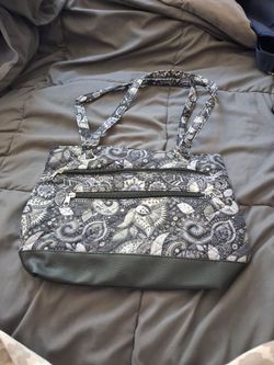 Intricate shoulder bag with multiple pockets
