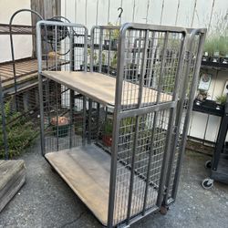 2 Steel Folding Container Shelf Trucks w/2 Shelves they are 56”H 23” D43”W fold to 6” Deep