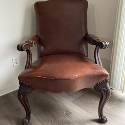 Two Brown Leather Queen Anne Claw Chairs