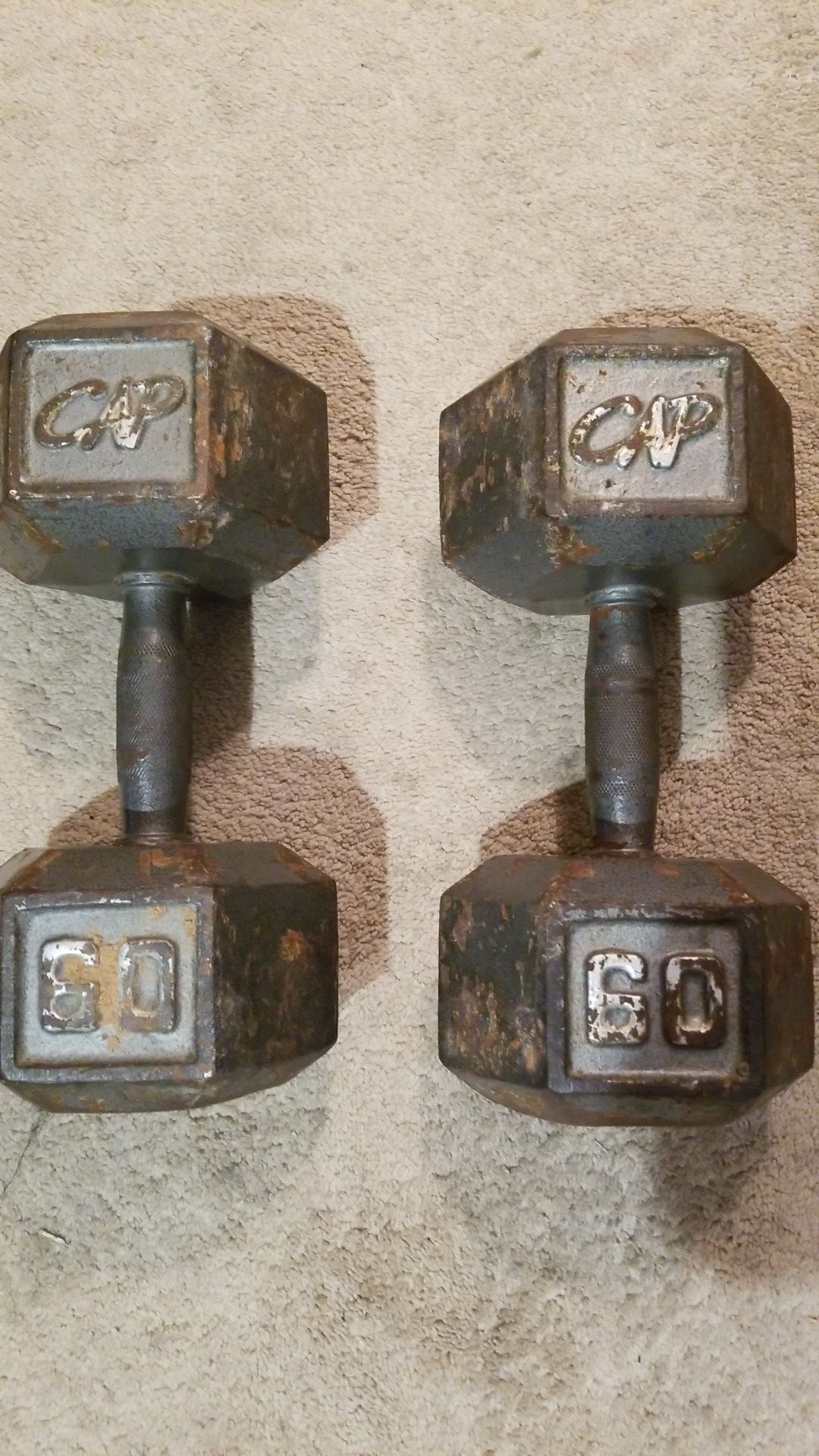 Two 60 pound dumbbells