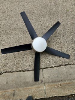 Brown ceiling fan with remote control.