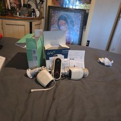 3 Arlo Cameras And Modem With Cables